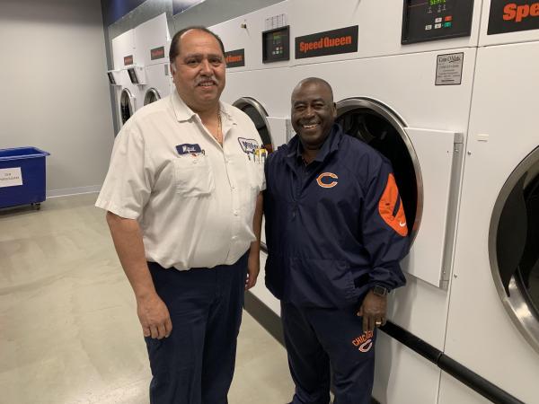 Miguel Estrada from Coin-O-Matic and Tony Medlin from the Chicago Bears