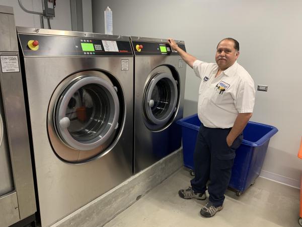 Coin-O-Matic team with Speed Queen laundry equipment in Chicago Bears stadium